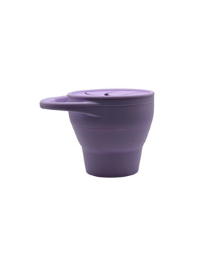 Silicone snack container for babies, angled view showcasing its durable, spill-proof design and vibrant colors.