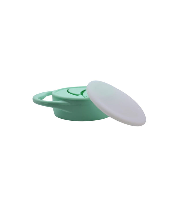 Silicone snack container for babies, angled view showcasing its durable design and vibrant color.