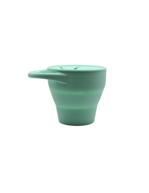 Silicone snack container for babies, angled view showcasing its durable design and vibrant colors. Perfect for on-the-go snacks.