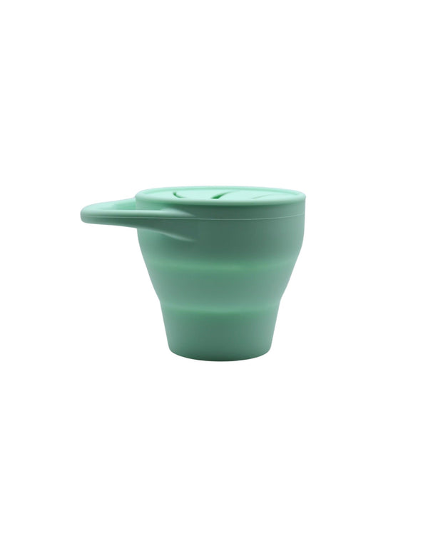 Silicone snack container for babies, angled view showcasing its durable design and vibrant colors. Perfect for on-the-go snacks.