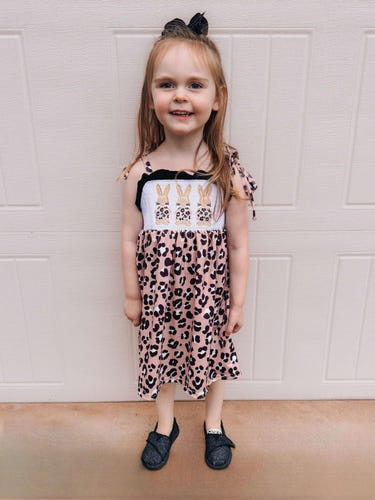 Smocked leopard bunny dress for babies, featuring a playful design and comfortable fit. Perfect for any occasion.