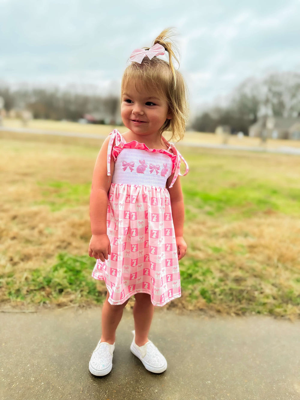 Smocked bunny bows dress for babies, perfect for spring and special occasions.