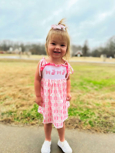 Smocked bunny bows dress for babies, perfect for spring and special occasions.