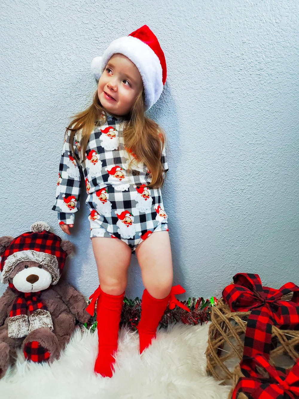 Checkered Santa ribbed hooded romper for babies, perfect for festive occasions and cozy comfort.