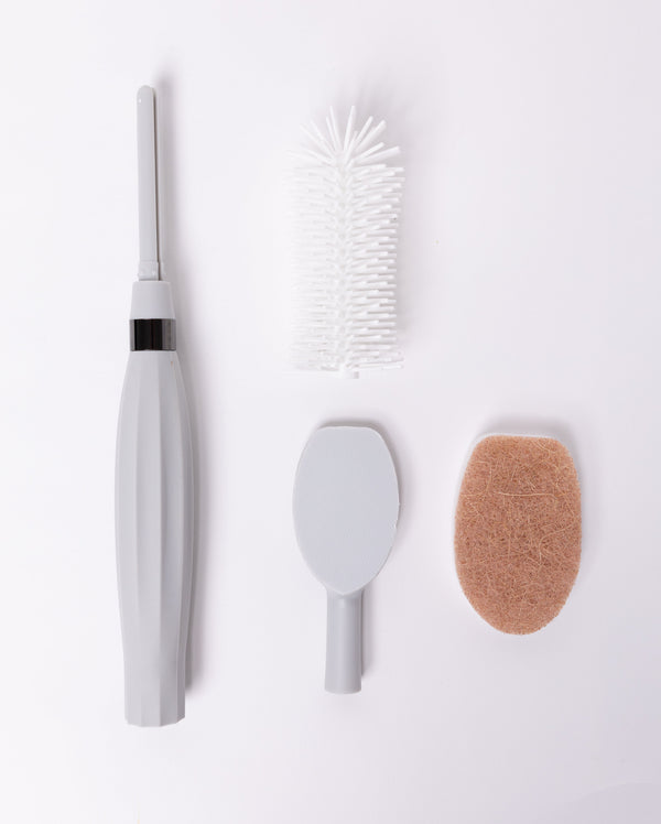 Spristle Wand Starter Set for babies, featuring colorful bottles and accessories, displayed at an angle.
