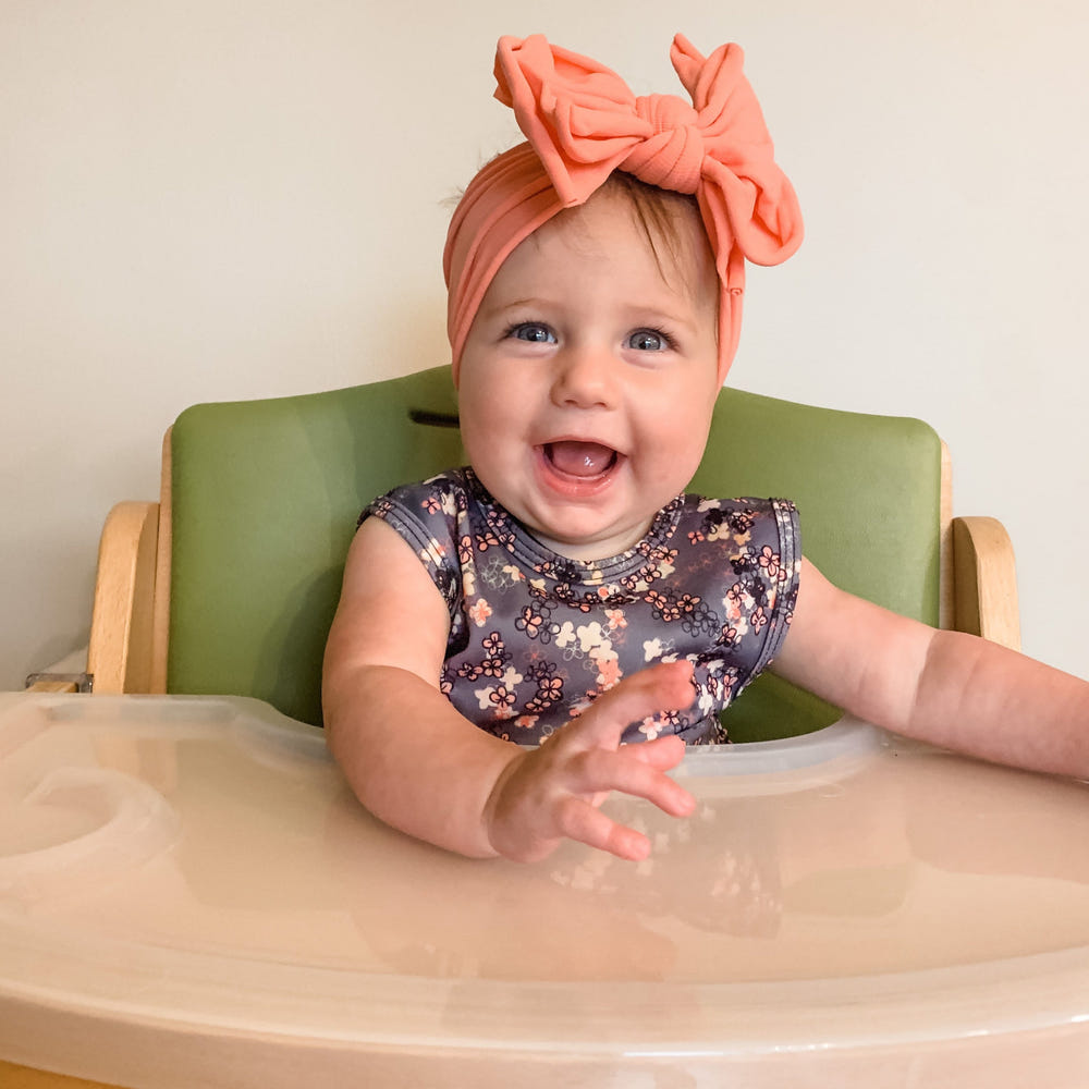 Ditsy Floral Bapron for babies, featuring a cute floral design and practical, stylish coverage for mealtime.