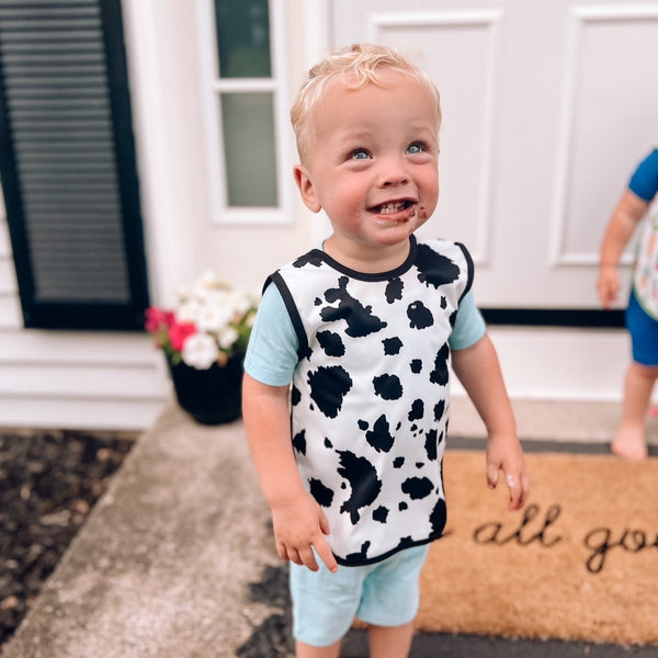 Cowhide Bapron on sale, angle view showcasing stylish design and functionality for babies.