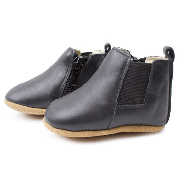 Black Chelsea Boot with soft sole for babies, perfect for stylish and comfortable footwear.