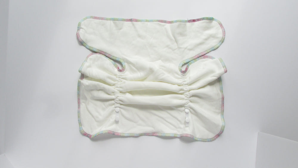 Flex-Fit Winged Perfect Fit Preflat cloth diaper in vibrant colors, ideal for eco-friendly baby care.