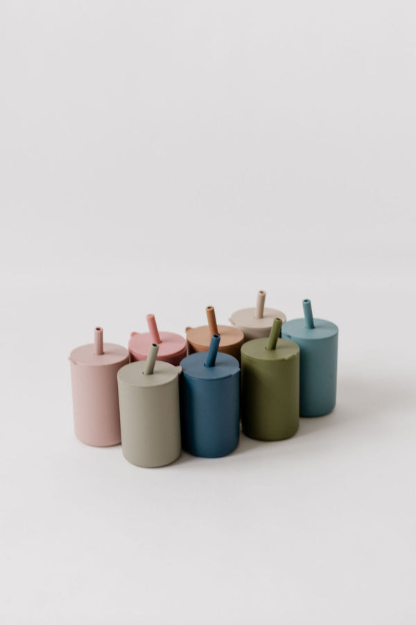 Colorful toddler cups with straws, perfect for little hands and spill-free sipping.