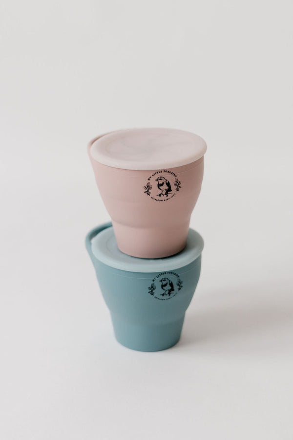 Silicone snack cups in angle 7 view, perfect for toddlers and easy to collapse for storage.