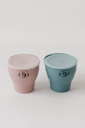 Silicone collapsible snack cups for babies, perfect for on-the-go snacks, shown from angle 2.