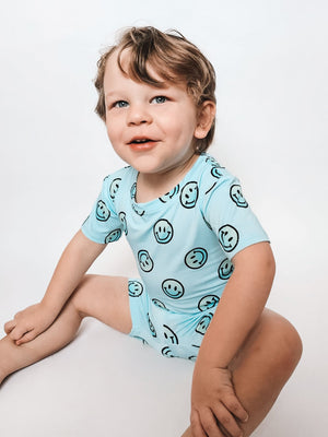 Ombre Smiles short set for babies, featuring soft bedding and sleep essentials, displayed from angle 3.