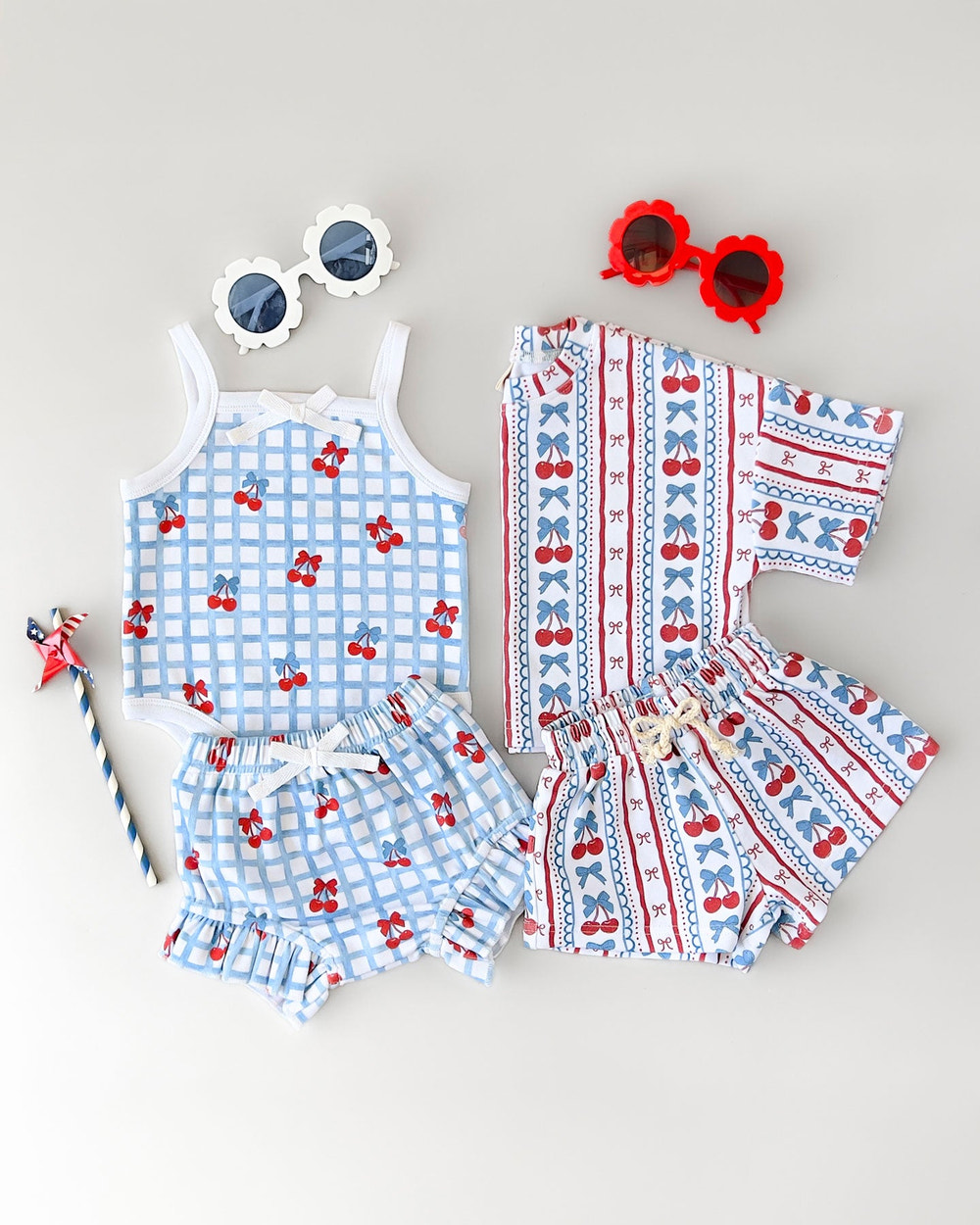Baby shorts set featuring cherries and stripes design, perfect for stylish summer outfits.