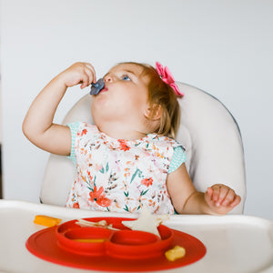Peachy Dreams Bapron for babies, angled view showcasing soft fabric and playful design. Perfect for mealtime messes.