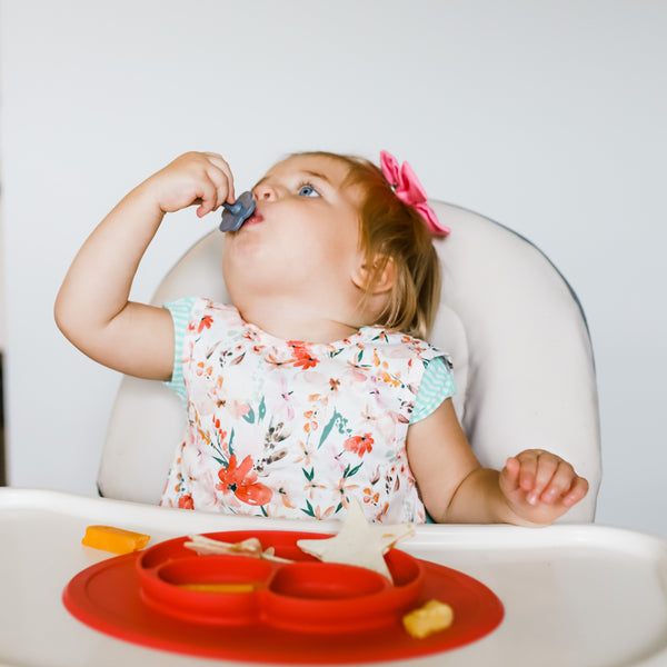 Peachy Dreams Bapron for babies, angled view showcasing soft fabric and playful design. Perfect for mealtime messes.