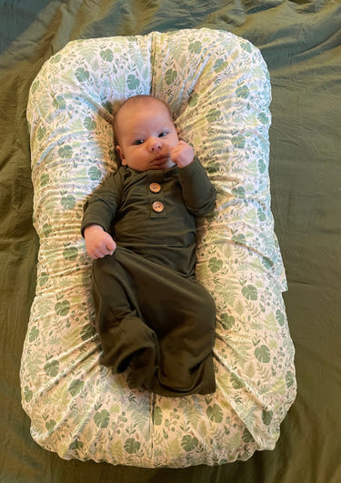 Tropical Leaves Lounger Slip Cover for baby duvet, featuring vibrant green leaf patterns on a cozy design.