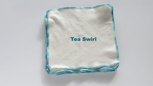 Stretchy flat cloth diapers in various colors, displayed at an angle for easy viewing and showcasing their flexibility.