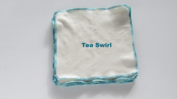 Stretchy flat cloth diapers in various colors, displayed at an angle for easy viewing and showcasing their flexibility.