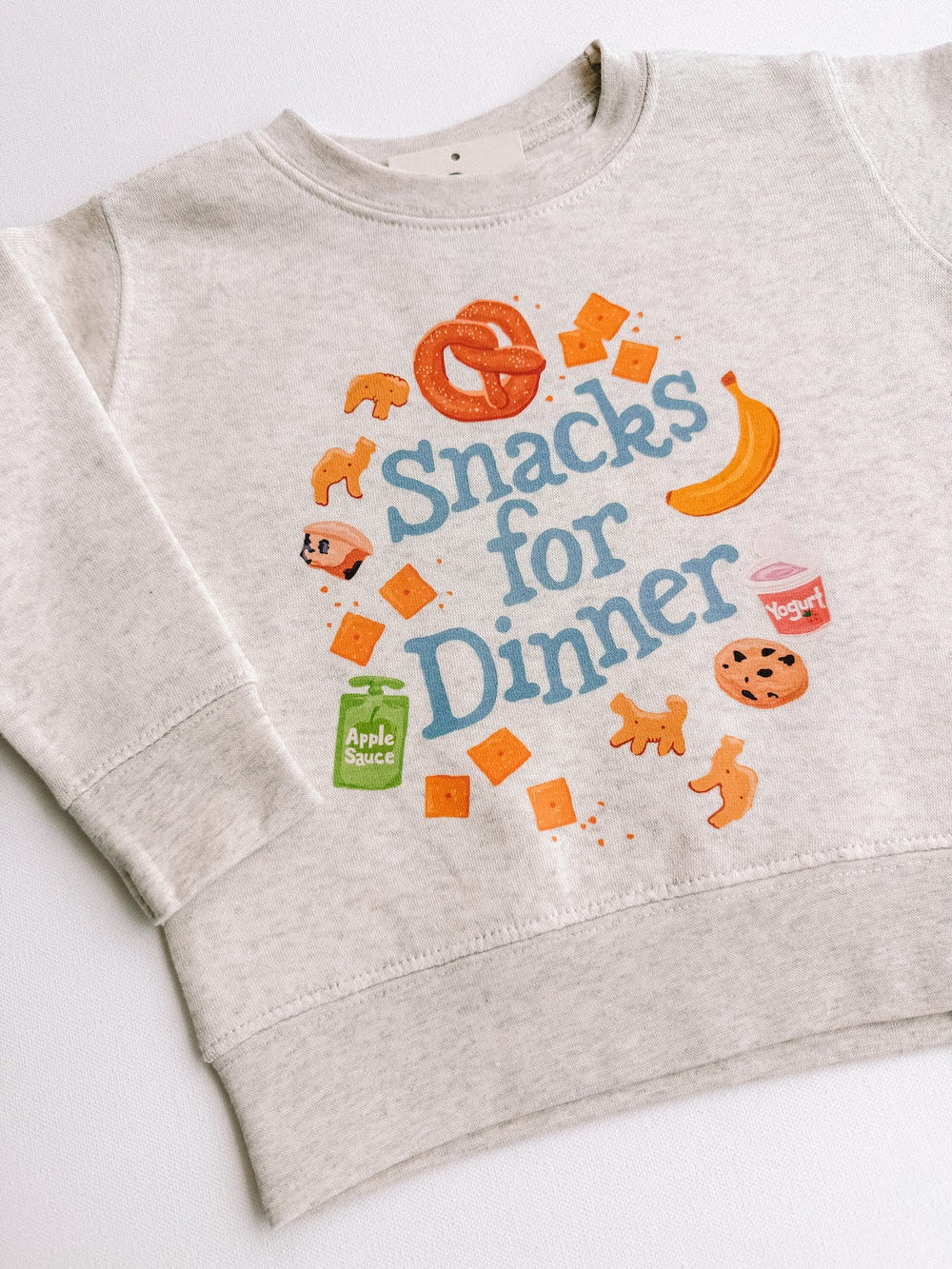 "Snacks for Dinner crewneck top for babies, stylish and comfy, perfect for casual wear."