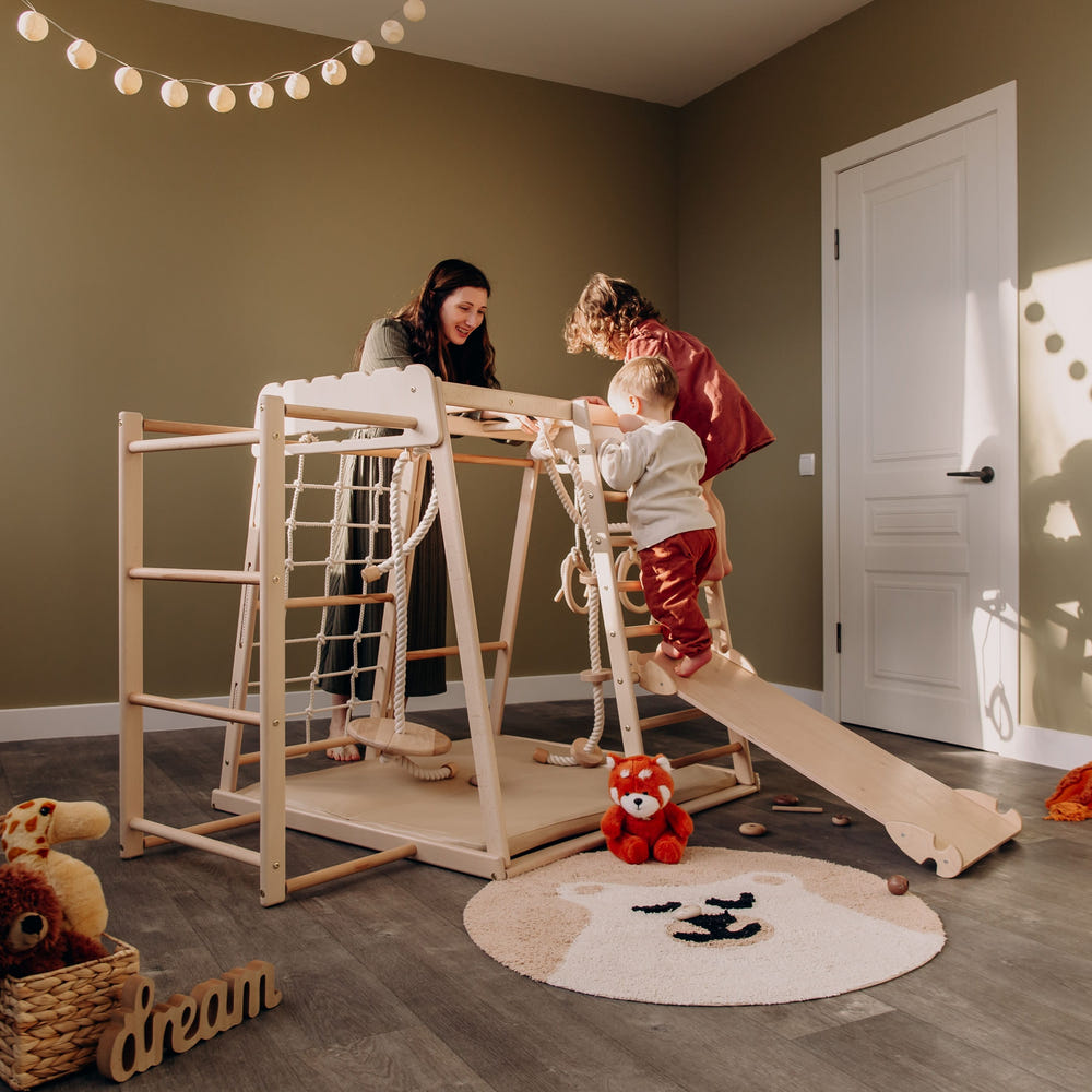 Indoor jungle gym for babies, featuring colorful climbing structures and safe play areas for indoor fun.