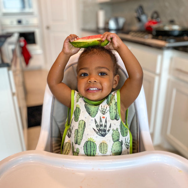 Desert Cactus Bapron for babies, featuring a fun cactus design, angled view showcasing its unique style and functionality.