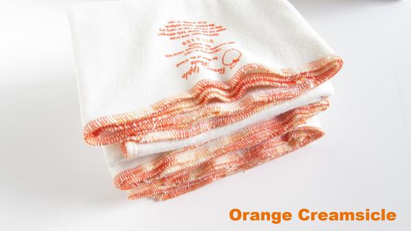 "Stretchy flat cloth diapers in various colors, angled view showcasing softness and flexibility for comfortable baby care."