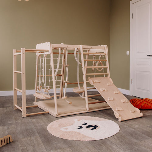 Indoor jungle gym for babies, featuring colorful climbing structures and safe play areas for indoor fun.