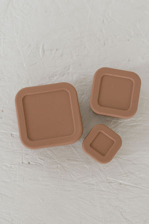 Silicone Bento box set of 3 for baby food storage and on-the-go meals, angled view showcasing vibrant colors.
