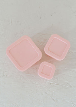 Silicone Bento box set of 3 for baby food storage and on-the-go meals, angled view showcasing vibrant colors.