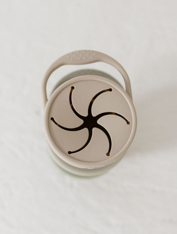 Silicone snack cups in an 18-degree angle, perfect for on-the-go snacks for babies and toddlers.