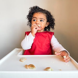 Solid cranberry minimalist bapron for babies, showcasing a stylish and functional design at angle 7.