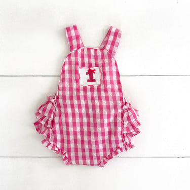 Hot pink first birthday bubble for girls, perfect for celebrating a special milestone in style.