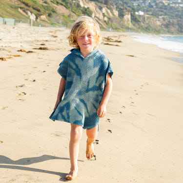Hand-dyed Shwally ponchos for babies, soft and cozy blankets perfect for swaddling and warmth.