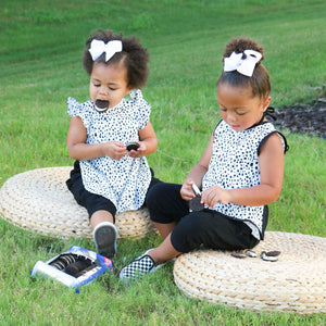 Organic Dot Flutter Bapron for babies, featuring a playful design and comfortable fit, angled view.