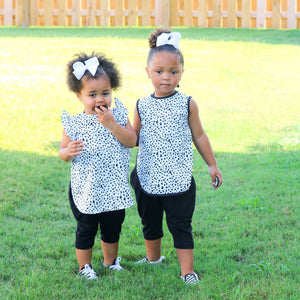 Organic Dot Flutter Bapron for babies, stylish and functional, shown at an angle for a clear view of design and fit.
