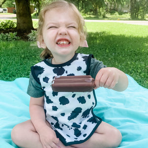 Cowhide Bapron on sale, angled view showcasing its unique design and functionality for babies.