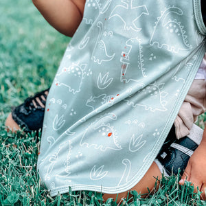 Dino Friends Sage Bapron for preschoolers on sale, angled view showcasing fun dinosaur design.