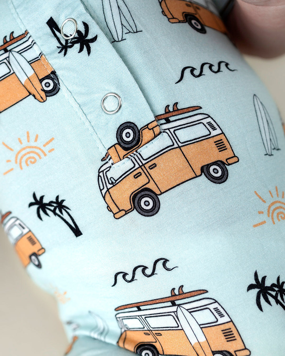 Bamboo jumpsuit for babies in Retro Beach design, perfect for stylish comfort.