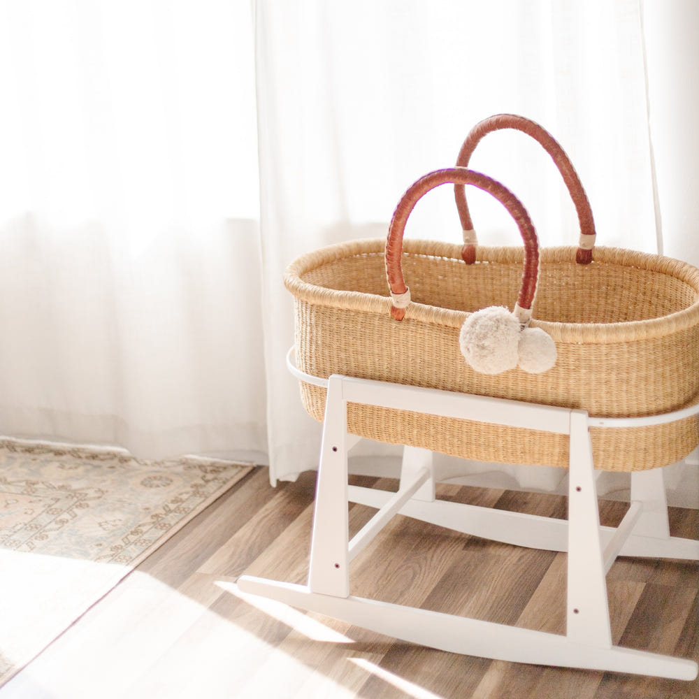 Original Rocking Moses Bassinet Stand in white with brake, perfect for soothing your baby safely.