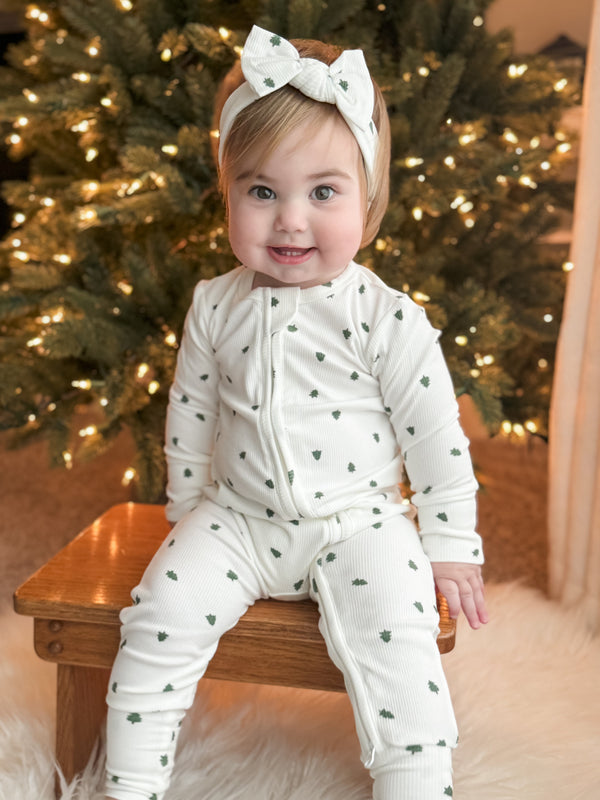 Tiny Trees Ribbed Bamboo Zippy Pajamas for babies, cozy sleepwear in soft bamboo fabric, angle view.