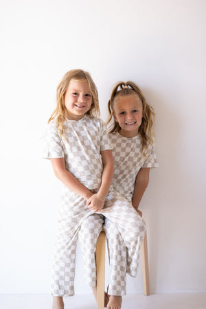 Baby checkerboard boxy tee lounge set in pajamas, angle view 6, perfect for cozy sleep and play.