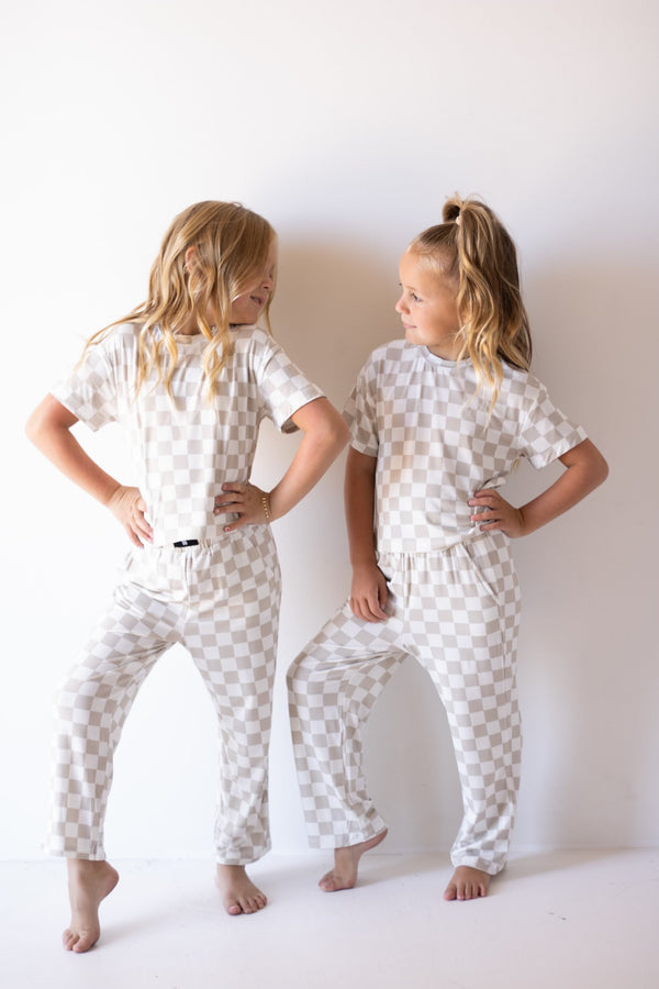 Child Boxy Tee Lounge Set in checkerboard pattern for babies, perfect for cozy pajama wear. Angle 3 view.