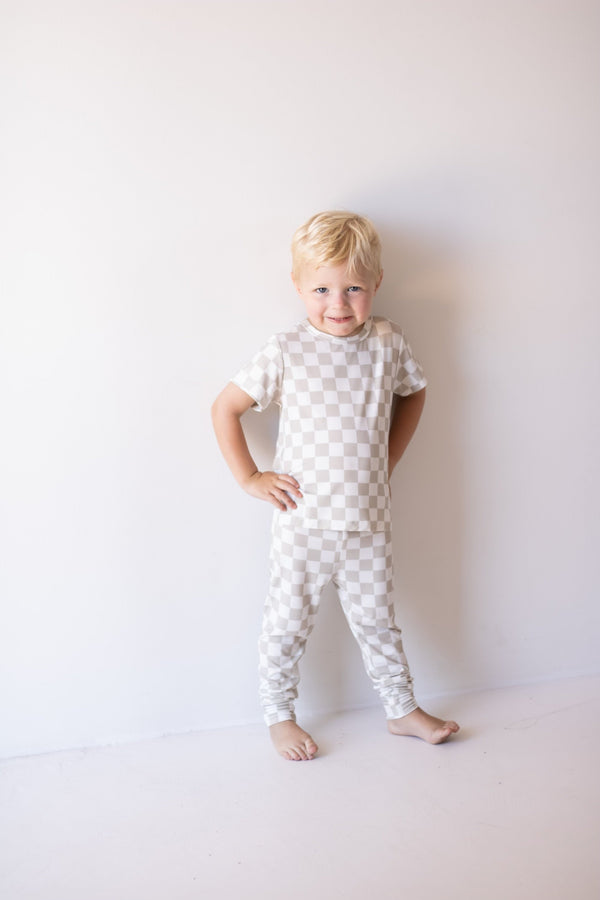 Bamboo two-piece checkerboard lounge set for babies, cozy pajamas in a stylish design.