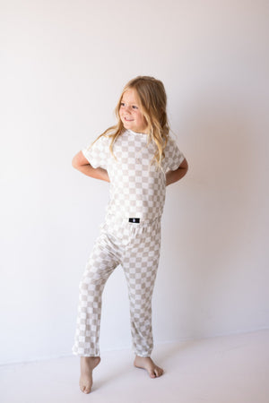 Child Boxy Tee Lounge Set in checkerboard pattern for babies, perfect for cozy pajama wear. Angle 2 view.