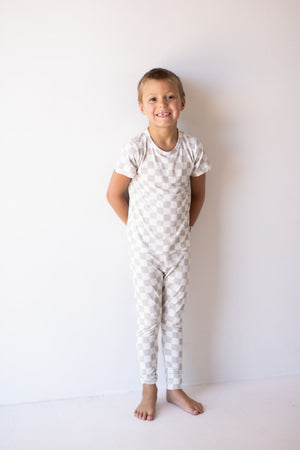 Bamboo two-piece checkerboard lounge set for babies, cozy pajamas in a stylish design.