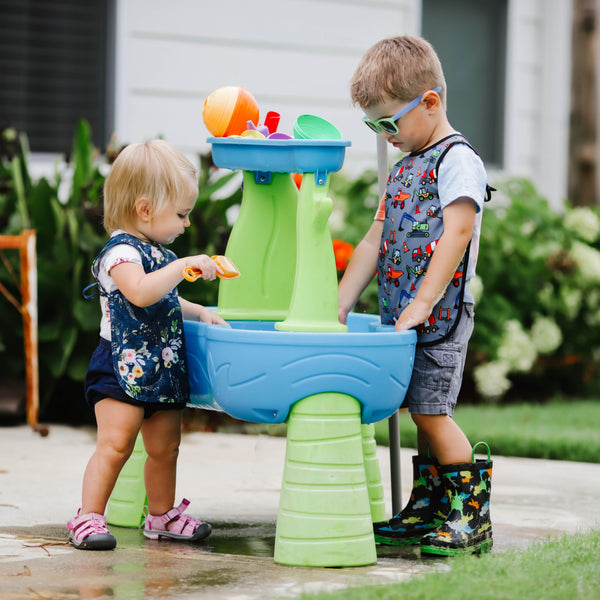 "Construction Zone Bapron for babies, featuring colorful construction vehicles, perfect for messy mealtime fun."