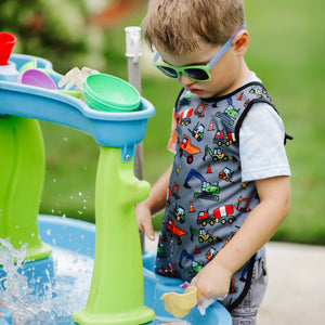 "Construction Zone Bapron for babies, featuring fun construction-themed design, perfect for mealtime messes."