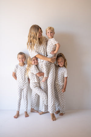Bamboo two-piece checkerboard lounge set for babies, cozy pajamas in a stylish angle view.