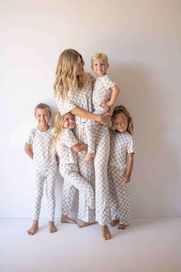 Bamboo two-piece checkerboard lounge set for babies, cozy pajamas in a stylish angle view.